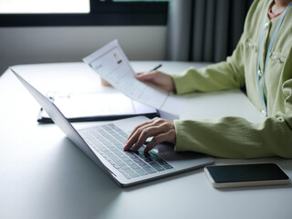 Businesswoman is reading a resume to evaluate a job applicant. Sitting reading a resume to hire...
