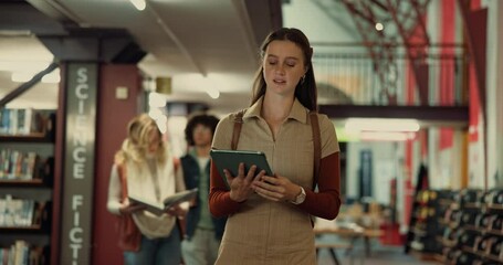 Woman, tablet and walking in library, education and online reading with social media. People, scholarship and students with tech, knowledge or learning with digital app, email or college with network - Powered by Adobe