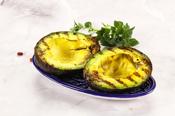 Sliced fresh avocado on the grill