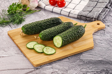 Raw green cucumbers with slices