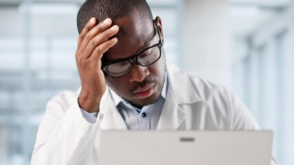 Frustrated Male Doctor Looking Worried At Computer, Sad