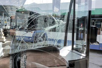 unbreakable frontal glass damaged by crash in a public transport bus