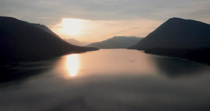 Majestic Mountain Lake with Sunset Reflecting on Calm Water