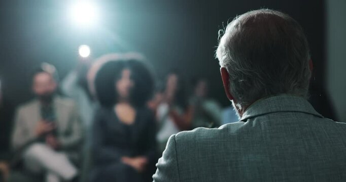 Press conference, speaker and person with motivation for crowd, talking or public speaking on stage. Presentation, back and politician with announcement for audience, speech and official event