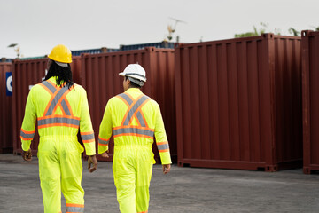 Two worker man working with checking container at container site	