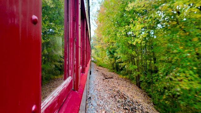 Moving vintage train at Conway scenic Railroad in White Mountains, New Hampshire, USA.
