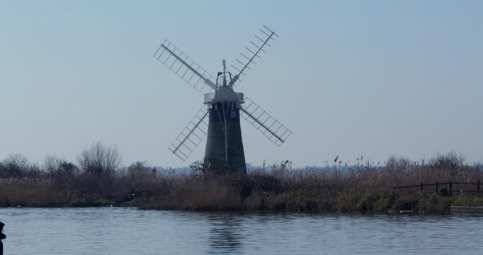 Wide shot of St benet&rsquo;s mill with the river Thurne