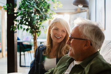 Senior couple enjoying a relaxed moment at home in the living room