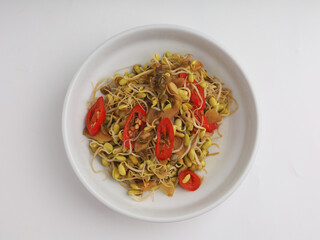 Stir fry mung beans sprout with garlic and chili on white background