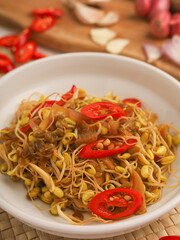 Stir fry mung beans sprout with garlic and chili on white background