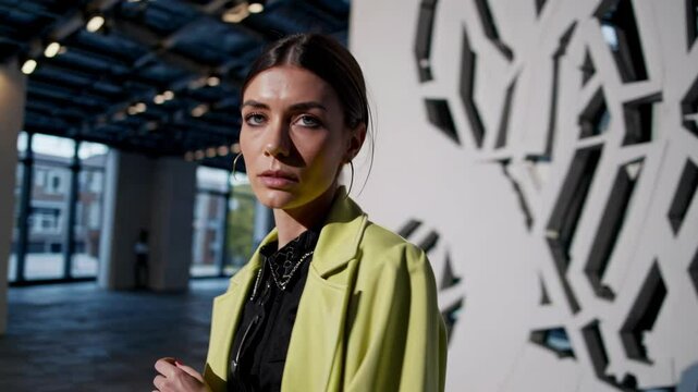 Stylish art curator posing in modern gallery