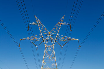 high voltage power lines with sunlight reflection