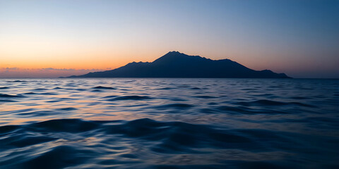 Fototapeta premium Serene Silhouette of Island Mountain at Sunrise