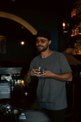 Young man tasting alcoholic drinks
