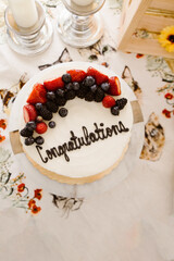 Celebration cake topped with berries and 