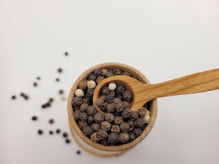 Colorful pepper seeds with wooden style.
