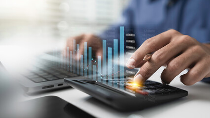 Close up businessman hand using calculator to financial management and Business finance accounting banking planning concept. Tax calculation to financial report Management of debt and budget