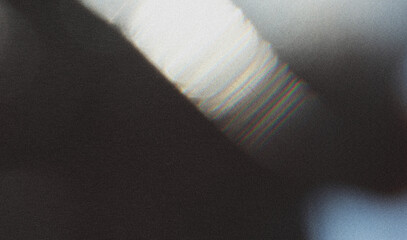 Abstract colorful texture. Surrealistic light leaks. Lights glowing in dark space.
