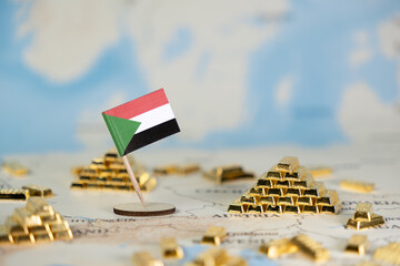 Sudan flag on a world map, surrounded by glistening gold bars, symbolizes the nation's rich natural...