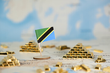 Tanzania flag positioned on a world map surrounded by golden bars, illustrating the nation's...
