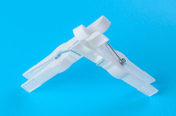 Innovative plastic clothespin design on a blue background for optimal functionality and user...