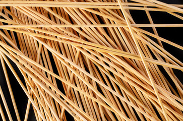 Chaotic Wooden Sticks Pattern on Dark Background – Abstract Natural Texture