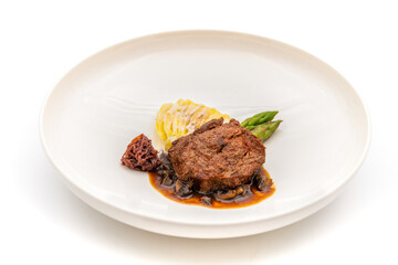 Grilled beef tenderloin with mashed potatoes, vegetables, and sauce