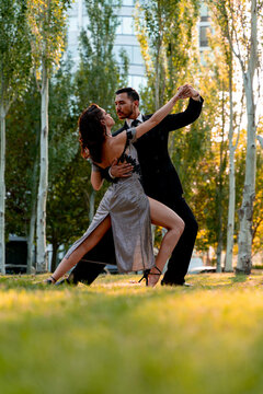 Male and female dancer practicing Tango dance at public park