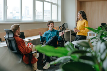 Colleagues having a casual meeting in a modern office