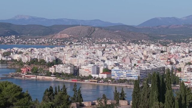 A panoramic drone view of Chalkida&rsquo;s seaside, capturing the city&rsquo;s coastal charm, waterfront walkway, and vibrant urban-meets-nature atmosphere.