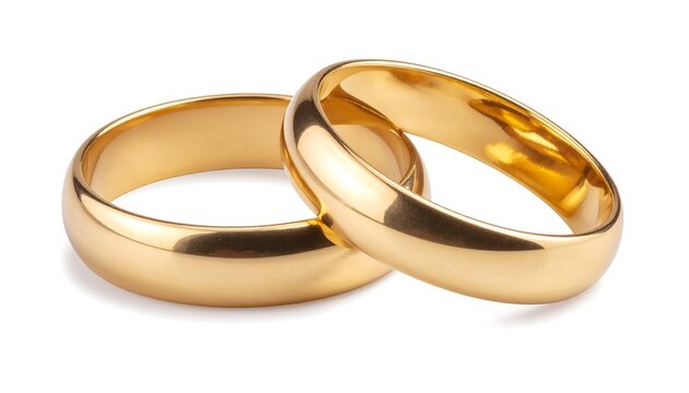 Two gold wedding bands interlocked on a white background with shadows cast underneath