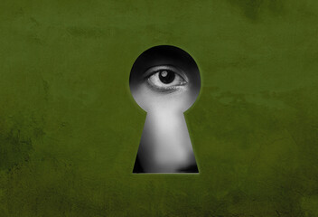 Mysterious gaze through a keyhole revealing an eye watching the world in a dimly lit environment