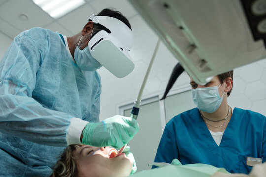 Dentist Using VR Headset at Work Low Angle View