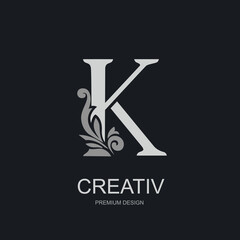 Capital Letter K with floral decorative element. Elegant monogram in silver on dark background. Perfect for logo, branding, boutique label, premium product design. Vector illustration.