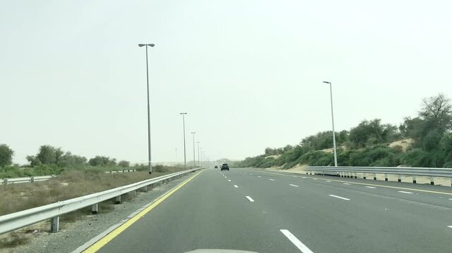 Driving Through Dubai Pov Driving Car Front Panorama Video Driving Plate. Driving on a desert highway outside of Dubai