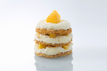 Gourmet Mango Mille-Feuille Stack with Piped Cream and Fresh Fruit