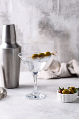 Traditional martini cocktail with olives and