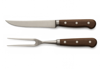 Steak cutlery set with serrated knife and carving fork on transparent background