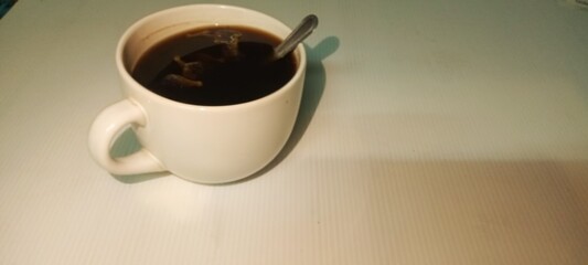 cup of coffee on wooden table