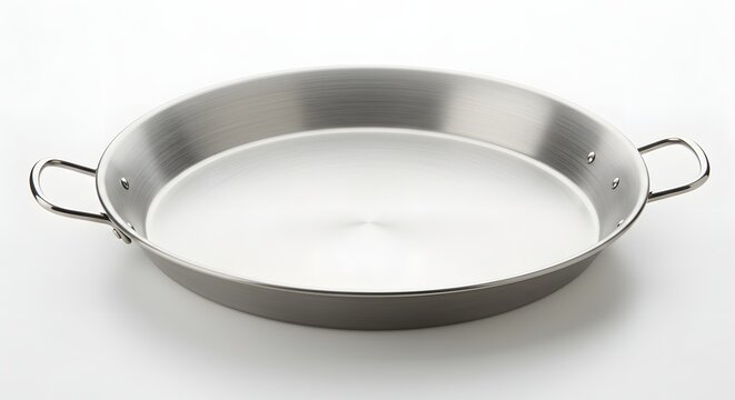 A close up shot of a silver paella pan with handles on a white background surface - Powered by Adobe