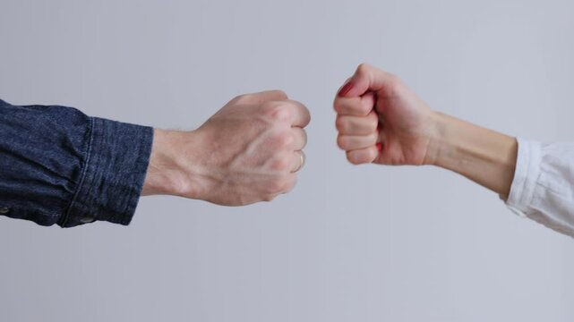 Fist to fist commit solidarity a respect gesture. Lifestyle business team hands fists close-up. Business concept of teamwork.