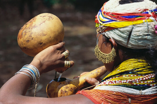 indian tribal woman drinking liquor palm wine India