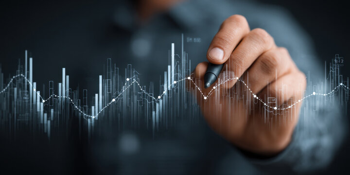 Closeup of male hand analyzing financial graph with stylus