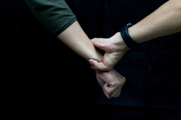 Support Hand Care with empathy hand gesture on black backdrop.