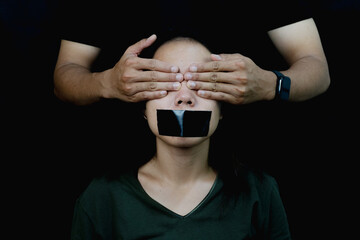 Silenced Womans Voice Stifled in Darkness Suppression and oppression.