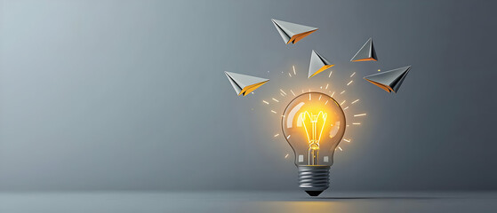 Illuminated Lightbulb With Paper Planes In Gray Background