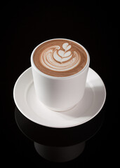 Hot Chocolate with Latte Art in White Cup on Black