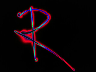 Glowing English letter R. On a black background with colored neon lines, a letter of the English alphabet is written by hand. The letter glows pink-red, creating a green-blue halo around it.