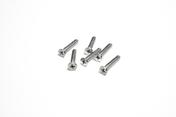 Several screws with pointed tips and Phillips head isolated.