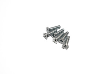 Group of small Phillips head screws used in various mechanical applications.